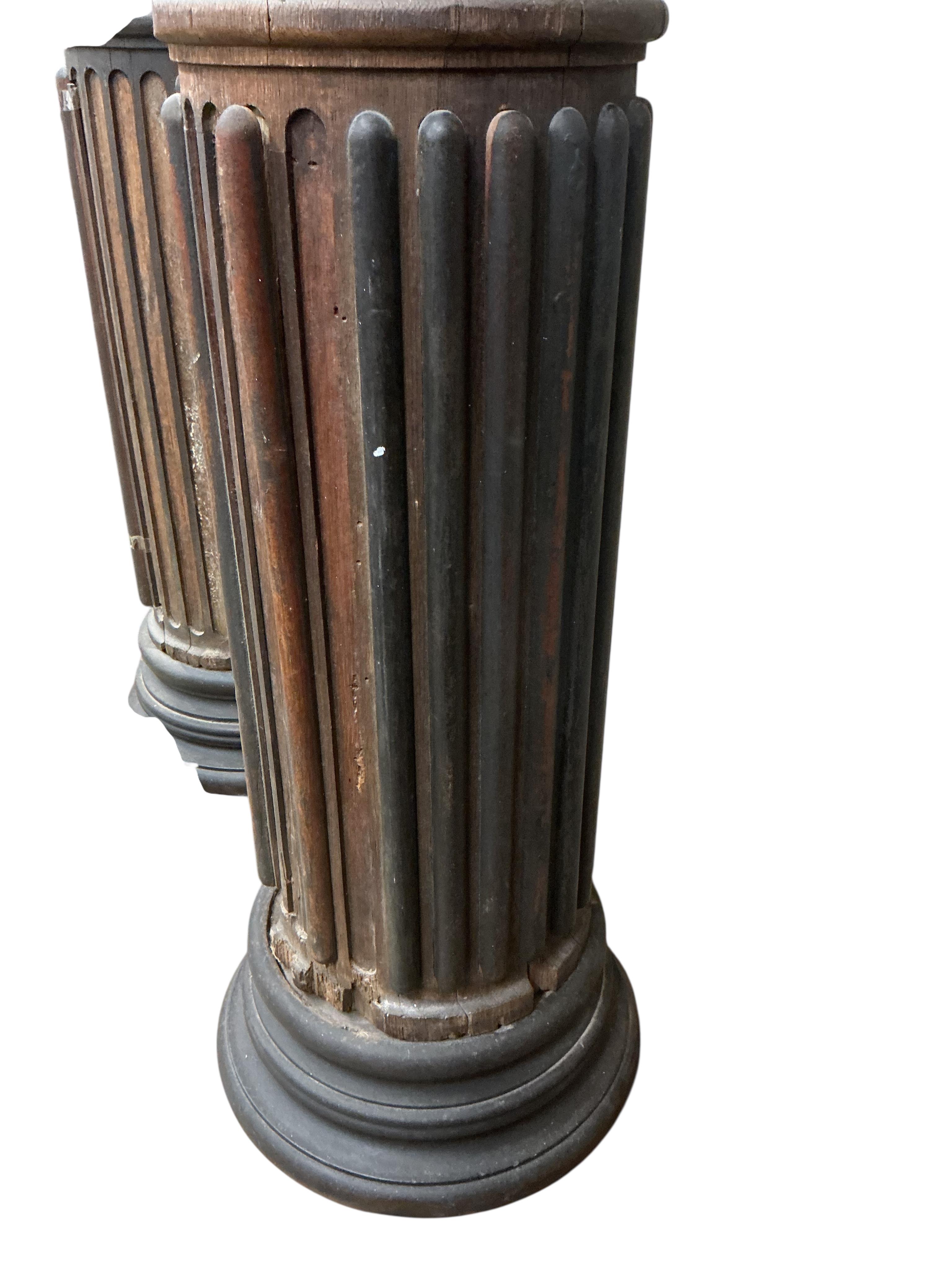 A pair of 17th century oak Corinthian columns, of large size, height 279cm, by repute from St Mary le Bow, designed by Christopher Wren